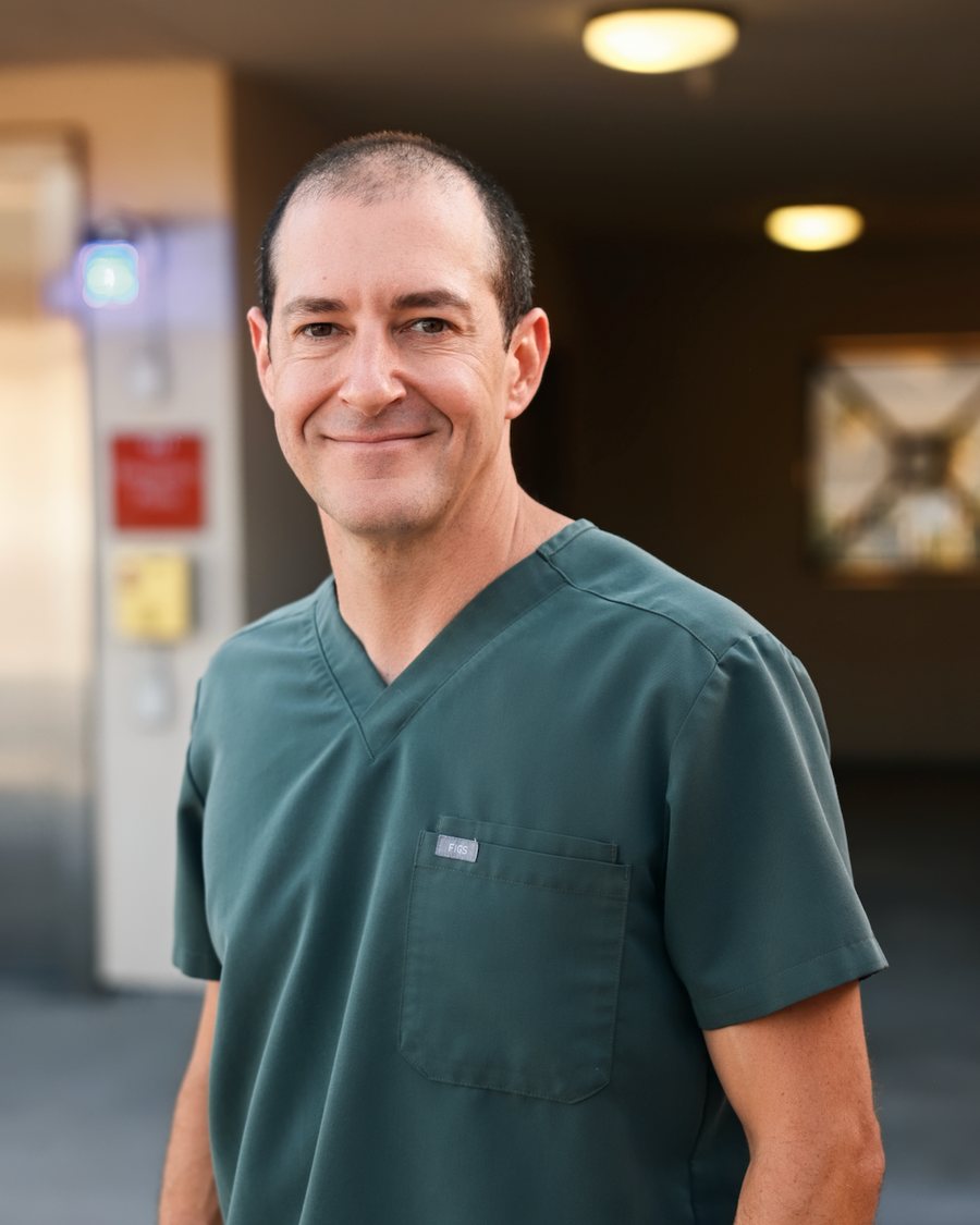 Peter O'Brien, nurse practitioner, in scrubs at Go Time Health in Temecula, California